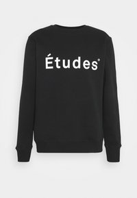 Sudadera negra de algodón, con un gran logo blanco "Études" en el frente. Cuello redondo clásico y puños acanalados.