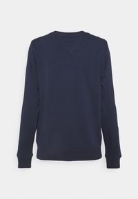 Sweat-shirt bleu marine à manches longues vu de dos, design simple, poignets et ourlet côtelés, aucun logo ou motif visible.