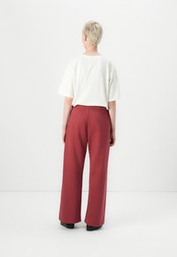 Replay PANTS LOGO - Pantalones deportivos - wine red