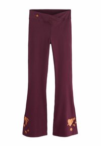 Marhuľovo červené rozšírené nohavice s prekríženým pásom a oranžovými grafickými detailmi, vrátane listov, sŕdc a hviezd pri leme.