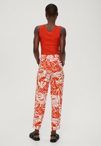 s.Oliver Tracksuit bottoms - dunkelorange