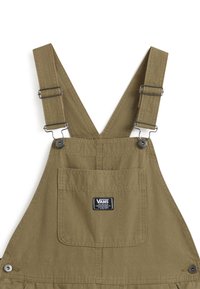 Olive green cotton overalls with adjustable straps, front pocket, and Vans logo tag. Features metal hardware and sturdy stitching details.