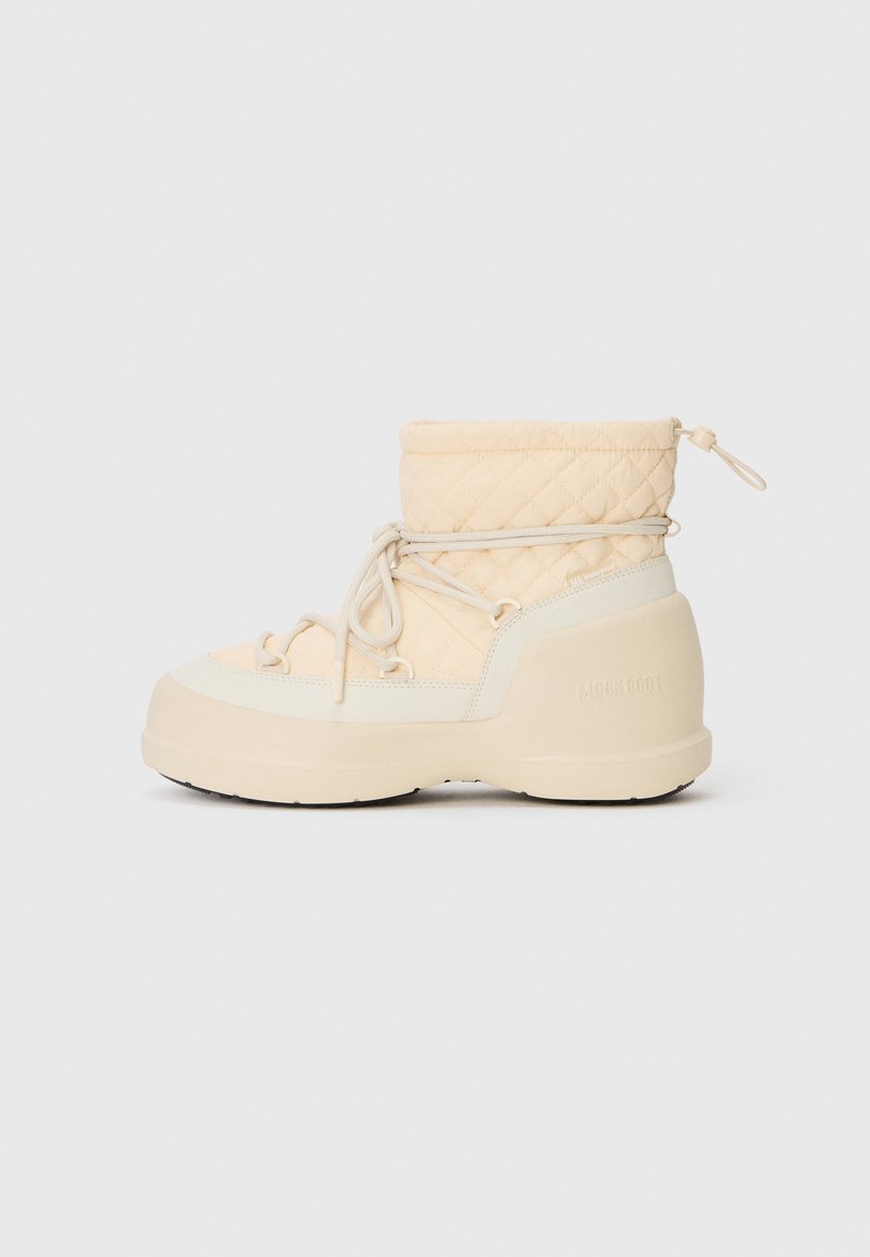 Beige quilted waterproof winter boot with thick sole, side laces, and a drawstring closure at the top.