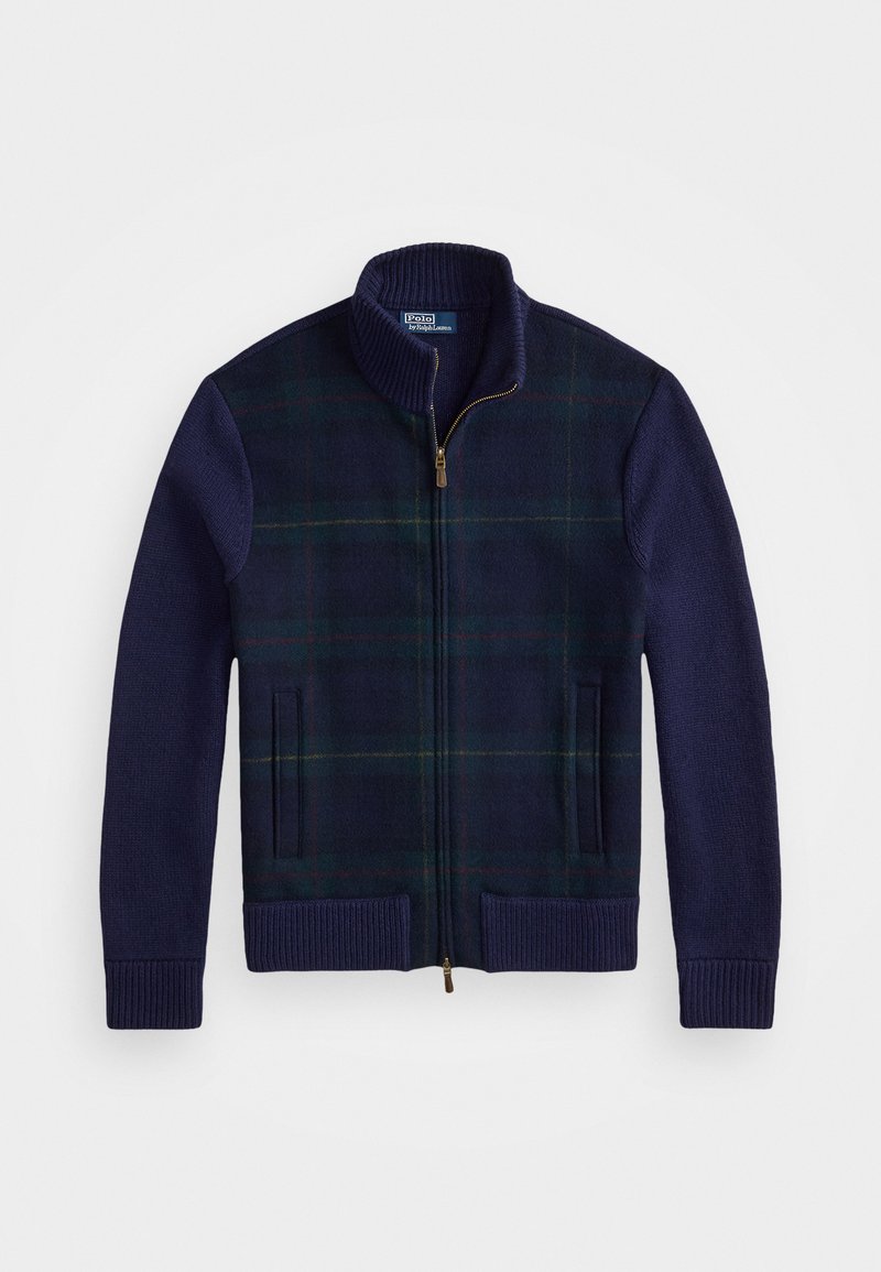 Navy and green plaid zip-up jacket with a high collar, knit sleeves, two front pockets, and a gold zipper detail. Soft wool blend texture.
