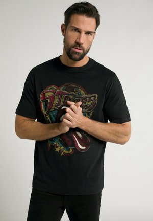 Sort bomulds T-shirt med et farverigt grafisk tryk af læber og stjerner, korte ærmer, rund halsudskæring og en afslappet pasform.