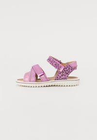 Rosa sandaler med glittriga remmar och leopardmönstrade detaljer. Har kardborrestängning och en flexibel vit gummisula.