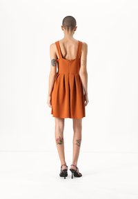WAL G PETITE DEBBIE BUCKLE SKATER DRESS - Jerseykjole - dusty orange