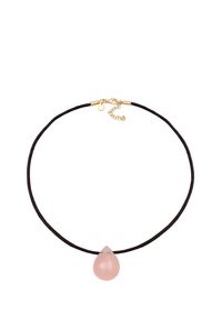 Black cord necklace features a translucent pink teardrop pendant; gold hardware at the clasp and extender chain. Simple and minimal design.