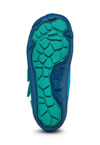 Suela de zapato con un diseño texturizado en azul y verde azulado, con un patrón de formas hexagonales e irregulares para mejorar la tracción.