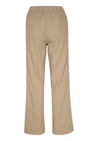 Pantalon beige à jambes larges avec une taille élastique, fabriqué dans un tissu léger, présentant un design simple et des lignes épurées. Sans poches.