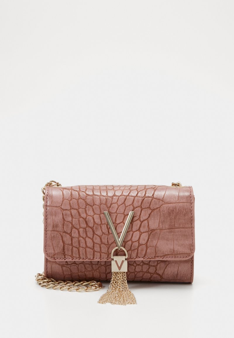 Pink textured handbag with a crocodile pattern, gold chain strap, and a decorative clasp featuring a tassel detail.