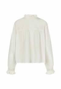 White blouse featuring long sleeves with elastic cuffs and delicate lace accents. The back shows a gathered design and ruffled neckline.