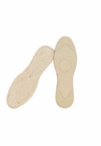 Semelles de chaussures beige clair avec une surface texturée, présentant un marqueur de taille circulaire « 39 » et un accent nervuré au niveau du talon.