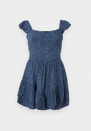 Navy blue dress with patterned fabric, square neckline, and short puff sleeves. Flared skirt with gathered details.