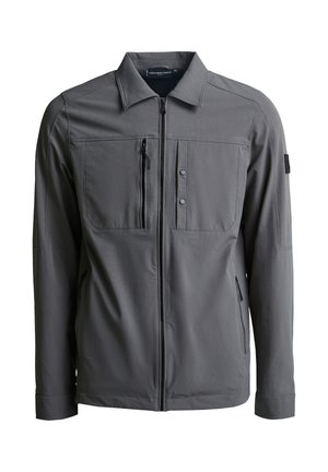 Giacca grigia con zip realizzata in un tessuto morbido. Presenta un colletto, due tasche frontali, una tasca sul petto con zip e dettagli hardware minimi.