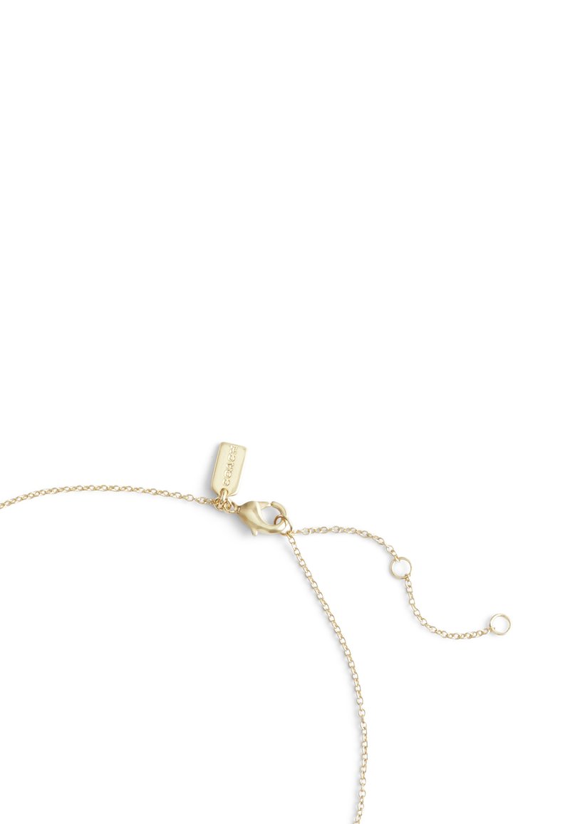 Bracciale in oro con chiusura a moschettone e lunghezza regolabile, caratterizzato da un piccolo tag con il nome del marchio inciso, collegamenti delicati e una finitura fine.