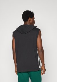 Champion SLEEVELESS HOODIE - Apdrukāts T-krekls - black