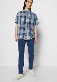 Lee RIDER - Calças de ganga justas - mid stone wash