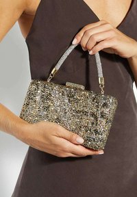 Glittering gold and silver beaded clutch with a crystal-embellished handle and a secure clasp; rectangular shape, textured surface.
