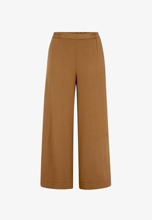 Bukser med vide ben og kort længde i lysebrun farve med elastik i taljen og tekstureret stof.