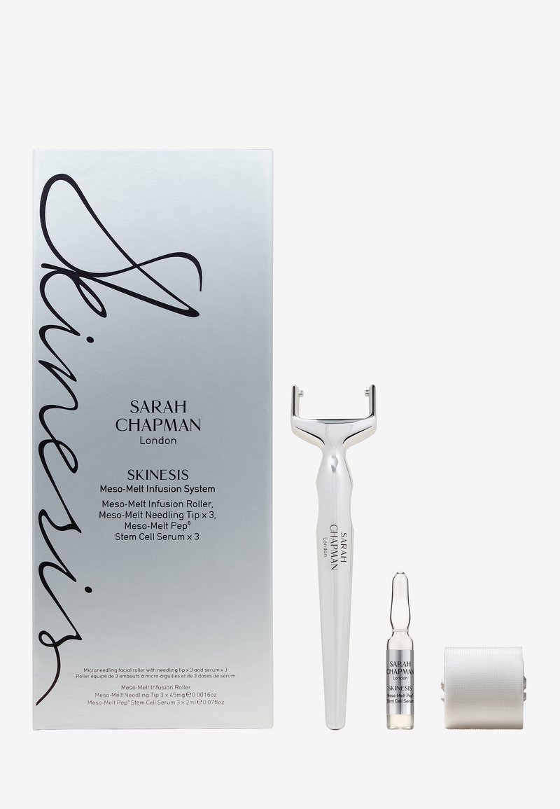 Skinesis Meso-Melt Infusion System with facial microneedling roller, serum vial, and three additional needle tips on white background.