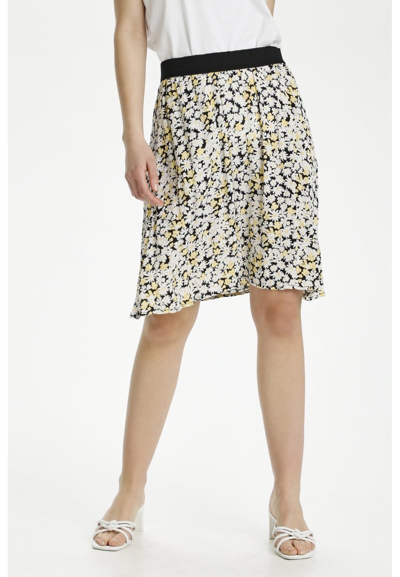 Blumiger Rock mit schwarzem Hintergrund und gelben sowie weißen Blumen, elastischem schwarzen Taillenbund, knielang, aus leichtem Stoff mit leichtem Fall.