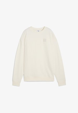 Cremfarbener Pullover aus weichem Stoff. Verfügt über einen runden Halsausschnitt, lange Ärmel und ein kleines Logo in einem Quadrat auf der Brust.