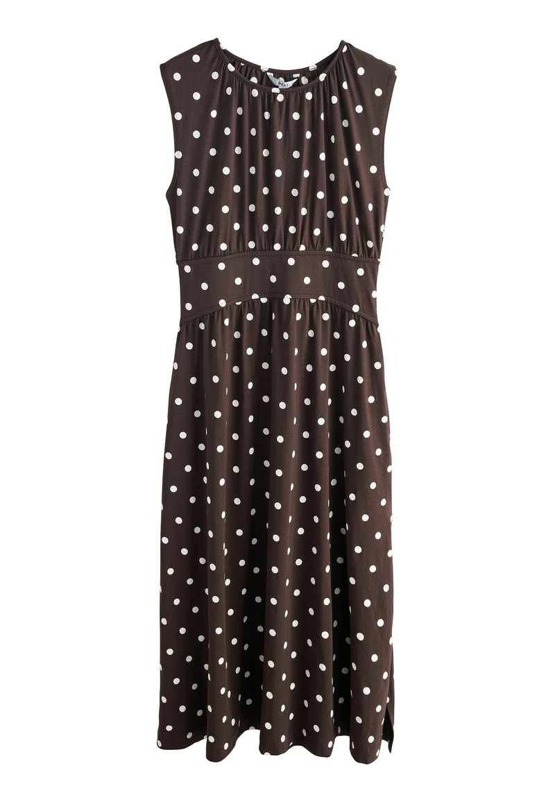 Rochie maro fără mâneci, cu un guler strâns, puncte albe, talie empire, fustă fluidă și fante laterale. Confectionată dintr-un material moale.