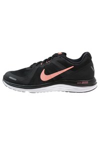 Black athletic shoes with a mesh upper, featuring a pink swoosh logo. The sole is white with a textured design for grip. "DUAL FUSION" label included.
