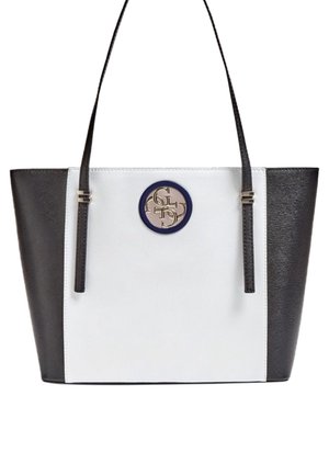 Black and white rectangular tote bag with thin black shoulder straps and a circular logo emblem in the center front.