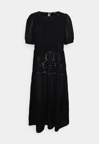 Robe noire en tissu tissé avec des détails en œillet. Elle présente des manches bouffantes, un col rond et un design superposé.