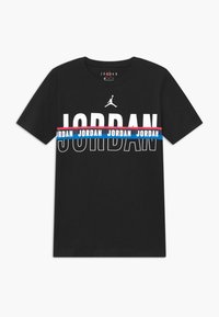 Black cotton t-shirt featuring large "JORDAN" text in white, flanked by blue and pink stripes. Includes a Jumpman logo above the text.