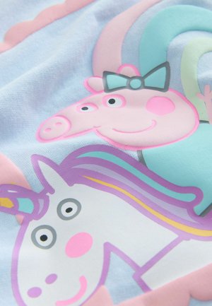 Baumwollstoff mit einem Grafikdesign von einem Schwein und einem Einhorn. Die Farben umfassen Rosa, Blau und Lila mit cartoonhaften Gesichtszügen und einer Schleife.