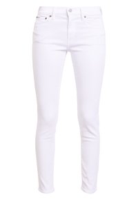 Jeans skinny bianchi in denim, con un classico design a cinque tasche, chiusura con bottone metallico e dettagli di cucitura sottili.