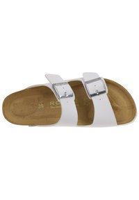 White two-strapped sandal featuring adjustable silver buckles, a brown suede footbed, and a durable white outsole. Size 39.