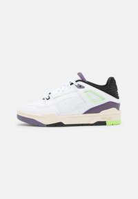 White sneakers with purple and green accents, featuring a leather upper, perforated toe, cushioned sole, and textured black heel panel.