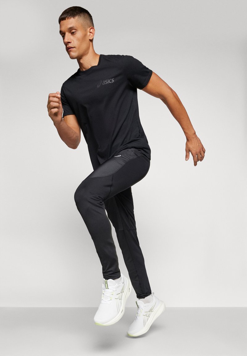ASICS ROAD PANT Pantaloni performance black/nero