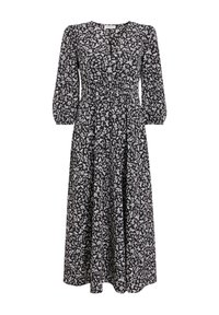 Robe noire à motifs floraux blancs, avec de longues manches bouffantes, un corsage ajusté et une jupe fluide. Fabriquée en tissu léger.