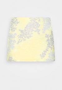 Saias mini amarelas com um padrão floral em cinza. Feita de um tecido macio com uma textura suave e um design justo.