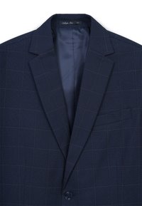 Marineblau gemusterter Blazer mit Reverskragen, einem Knopf und Tasche. Innen mit einfarbigem dunklem Stoff ausgekleidet, mit einem Karomuster.