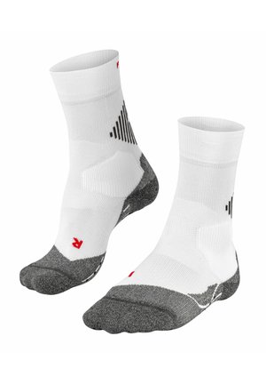 Calze sportive bianche con accenti grigi, caratterizzate da un design a coste, suola testurizzata e strisce diagonali nere. Altezza corta alla caviglia.