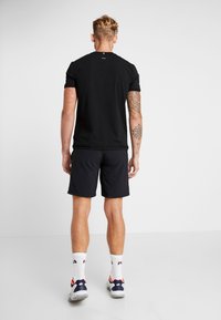Fila SHORTS SANTANA - Spordišortsid - black