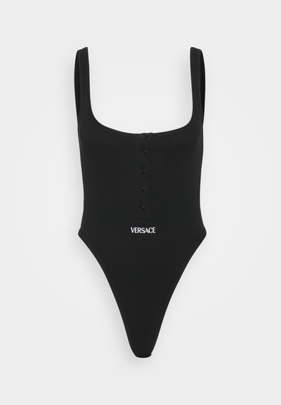 Black one-piece swimsuit with a scoop neckline, wide straps, button detailing at the front, and Versace logo in white at the waist.