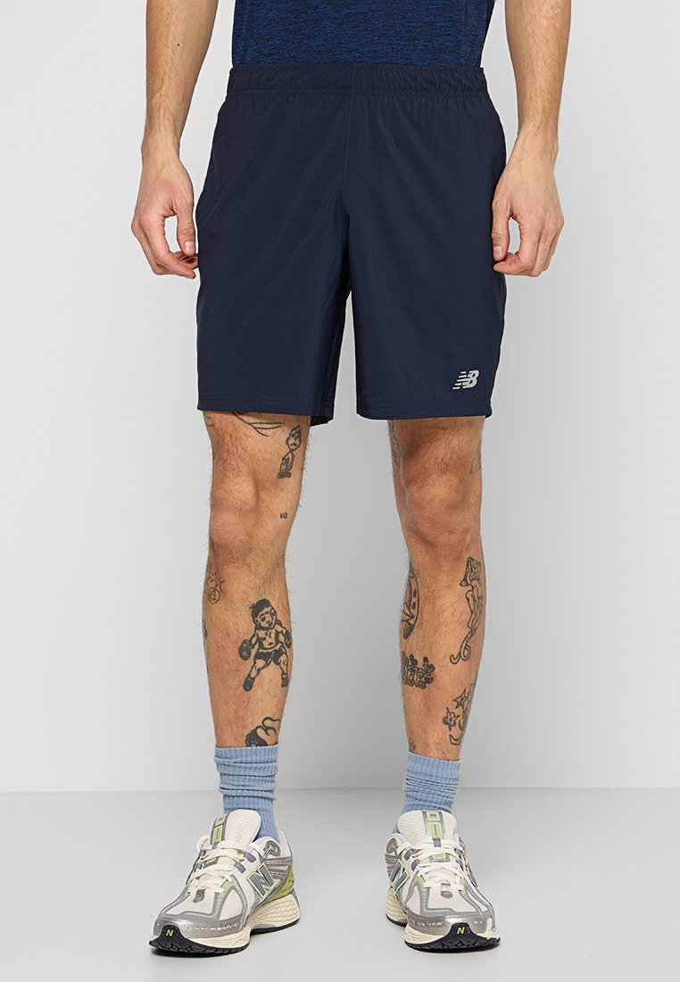 New Balance Korte broeken oranje New Balance Korte broeken oranje