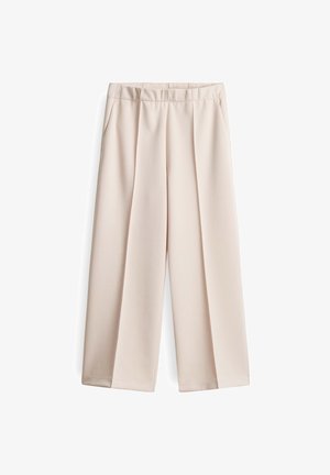 Beige, weite Hosen mit glatter Textur, elastischem Bund und zwei Fronttaschen. Mit Fältchen für zusätzlichen Detail.