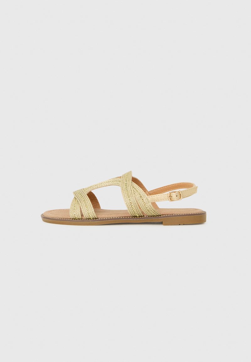 Cassis côte d’azur Sandalen goudkleurig