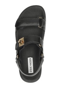 Zwarte lederen sandaal met verstelbare band, gouden hardware accent, gevoerde zool en gladde textuur. Merklabel zichtbaar.