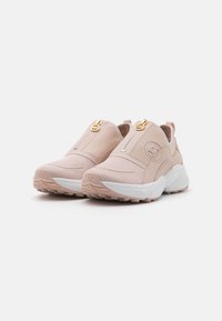 Light pink slip-on sneakers with mesh panels, gold hardware accents, textured rubber soles, and a minimalist design with logo detailing.
