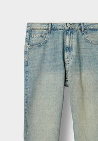Light blue denim jeans with a straight fit, five pockets, and a button closure. Features subtle fading and a classic stitched design.