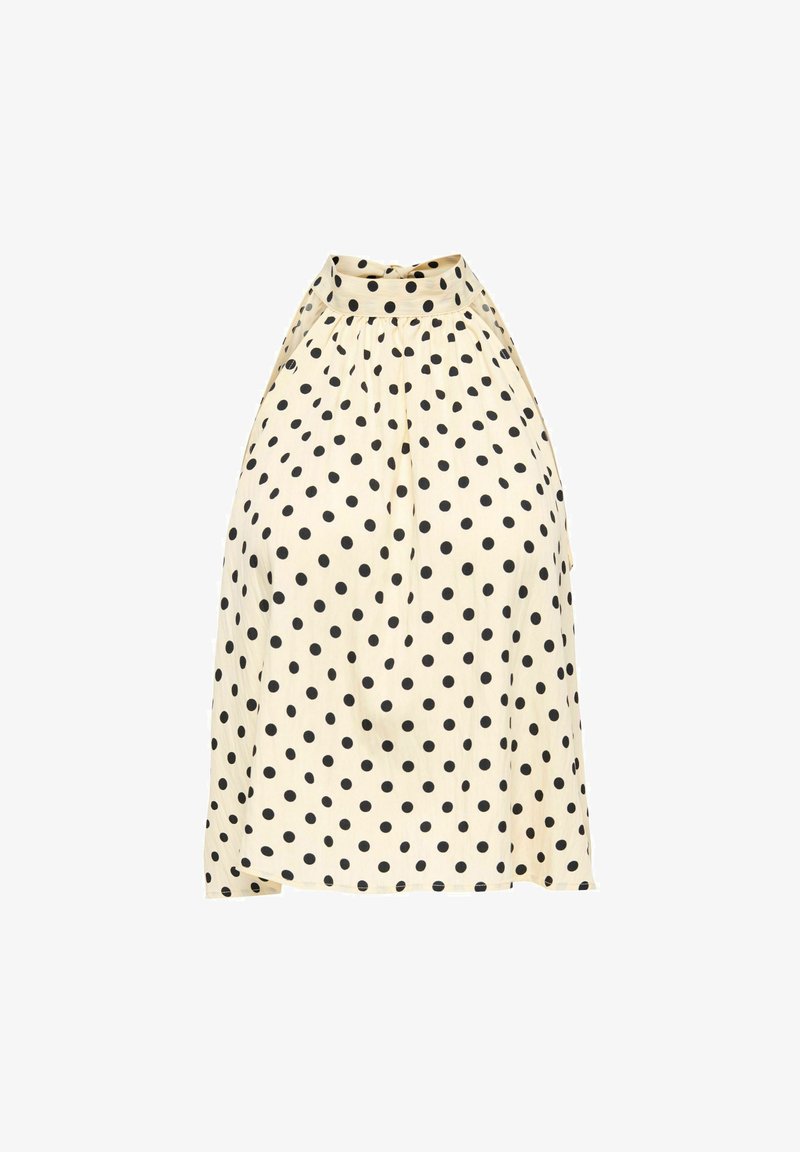 Haut sans manches crème à col montant avec pois noirs et détail de tissu froncé.